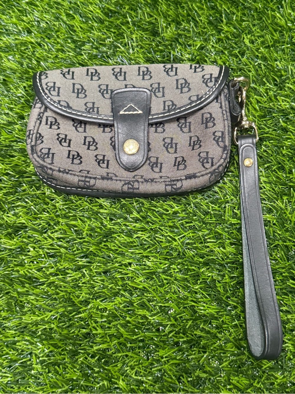 Authentic vintage Y2K-era Dooney & Bourke mini flap wristlet clutch.